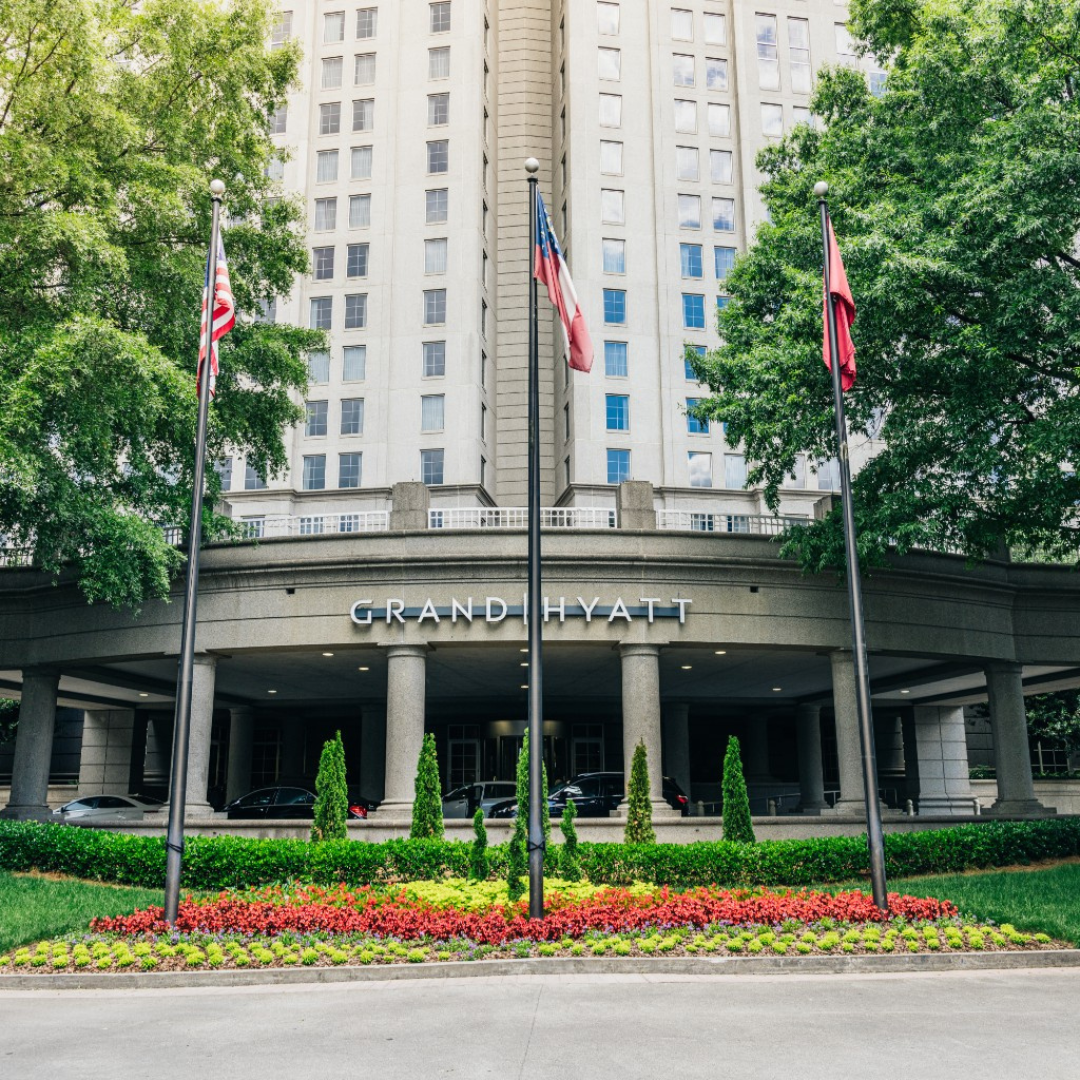 Grand Hyatt Atlanta Buckhead front entrance with flags and flowers