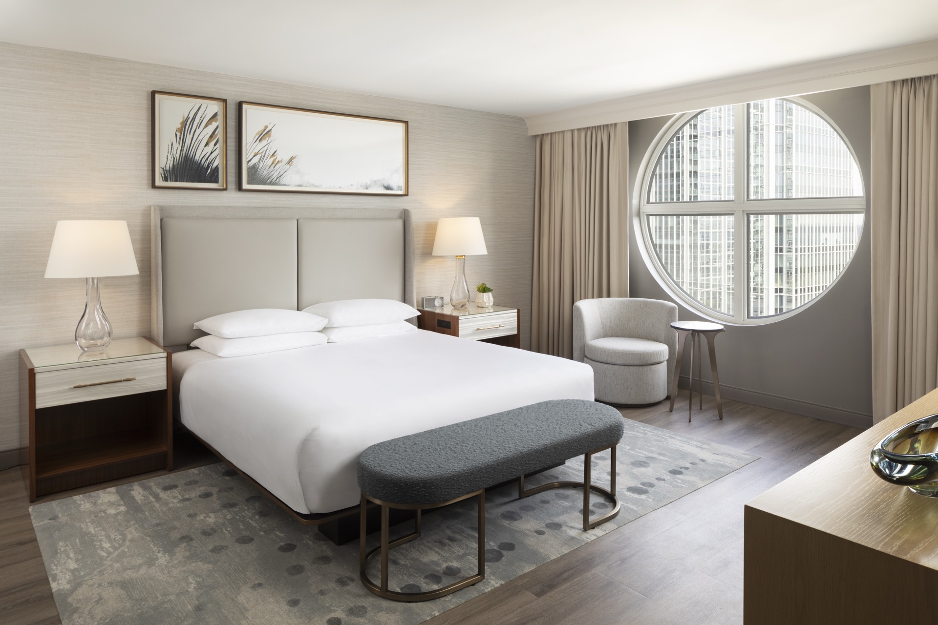 Newly renovated king guestroom with porthole window and city view