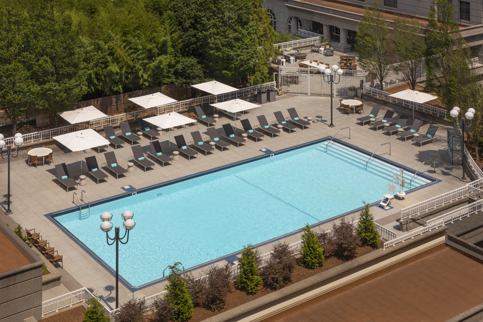 Grand Hyatt Atlanta resort pool with loungers and Buckhead skyline